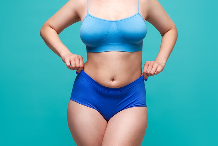 Plus,Size,Model,In,Blue,Underwear,On,Turquoise,Background,,Body